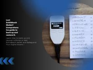 Schildbach Wallet device with handwritten backup list on wooden surface.