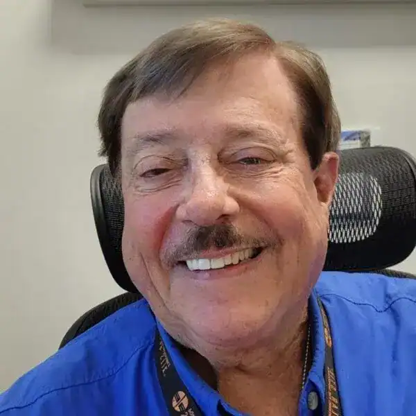 Professional team member at Swift Response Crypto smiling confidently.